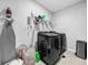 This laundry room features a new washer and dryer and ample shelf space for storage at 11946 Brighton Knoll Loop, Riverview, FL 33579