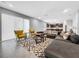 Beautiful living room with ample seating, stylish rug, and a view into the kitchen at 11946 Brighton Knoll Loop, Riverview, FL 33579