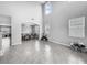 Bright living room features soaring ceilings and ample natural light, adjacent dining area at 11946 Brighton Knoll Loop, Riverview, FL 33579
