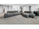 Comfortable loft area with a large sectional sofa and soft carpet flooring at 11946 Brighton Knoll Loop, Riverview, FL 33579
