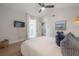 Bright bedroom with a comfortable bed, access to a balcony, and a coastal-inspired decor at 125 Harbor Bluff Dr, Largo, FL 33770