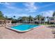 Community pool with lounge chairs and a spa at 2400 Winding Creek Blvd # 3-202, Clearwater, FL 33761