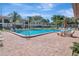 Inviting community swimming pool with plenty of lounge chairs at 2400 Winding Creek Blvd # 3-202, Clearwater, FL 33761