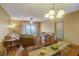 Bright dining area with wood table and access to balcony at 2400 Winding Creek Blvd # 3-202, Clearwater, FL 33761