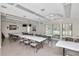 Community room with tables and chairs, suitable for meetings at 2400 Winding Creek Blvd # 3-202, Clearwater, FL 33761
