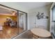 Sunroom with sliding glass doors revealing the living and dining areas at 2400 Winding Creek Blvd # 3-202, Clearwater, FL 33761