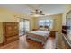 Well-lit bedroom with sliding door to balcony at 2400 Winding Creek Blvd # 3-202, Clearwater, FL 33761