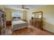Comfortable bedroom with wood floors and plenty of light at 2400 Winding Creek Blvd # 3-202, Clearwater, FL 33761