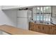 Small community kitchen with countertop, sink, and appliances at 2400 Winding Creek Blvd # 3-202, Clearwater, FL 33761