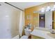Clean bathroom with a bathtub, toilet and vanity at 2400 Winding Creek Blvd # 3-202, Clearwater, FL 33761