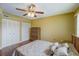 Bright bedroom with a double bed and built-in wardrobe at 2400 Winding Creek Blvd # 3-202, Clearwater, FL 33761