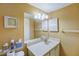 Simple bathroom with vanity, sink, and medicine cabinet at 2400 Winding Creek Blvd # 3-202, Clearwater, FL 33761