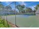 Tennis court with chain-link fence at 2400 Winding Creek Blvd # 3-202, Clearwater, FL 33761