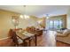 Bright dining area with wood table and access to balcony at 2400 Winding Creek Blvd # 3-202, Clearwater, FL 33761