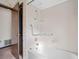 Bathroom with shower over tub and grab bars at 5025 Bridgeport Dr, Safety Harbor, FL 34695