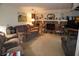 Spacious living room featuring a stone fireplace and comfortable seating at 2407 Medulla Rd, Plant City, FL 33566