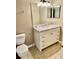 Elegant bathroom with a vanity, granite countertop, and a large mirror at 10750 Keys Gate Dr # 10750, Riverview, FL 33579