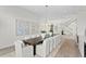 Elegant dining room features a large table and chandelier at 96 Martinique Ave, Tampa, FL 33606