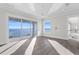 Bedroom with sliding glass doors leading to a balcony and water views at 96 Martinique Ave, Tampa, FL 33606