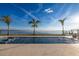 Large rectangular pool with spa and water view at 96 Martinique Ave, Tampa, FL 33606