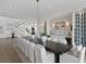 Open concept dining room with a large table and wine storage at 96 Martinique Ave, Tampa, FL 33606