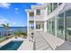 Inviting pool area with expansive patio and water views at 96 Martinique Ave, Tampa, FL 33606