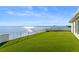 Stunning rooftop deck overlooking the water with artificial turf at 96 Martinique Ave, Tampa, FL 33606