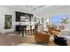 Dark wood bar with seating, opens to patio with water views at 96 Martinique Ave, Tampa, FL 33606