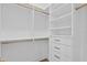 Large walk-in closet featuring built-in shelving and hanging rods at 96 Martinique Ave, Tampa, FL 33606