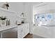 White bathroom with wet bar, quartz countertops, and a large shower at 96 Martinique Ave, Tampa, FL 33606