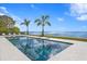 Stunning waterfront pool with deep blue tiles at 96 Martinique Ave, Tampa, FL 33606