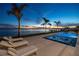 Luxury waterfront home with private pool and spa at sunset at 96 Martinique Ave, Tampa, FL 33606