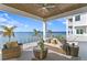 Spacious waterfront patio with wicker furniture and breathtaking water views at 96 Martinique Ave, Tampa, FL 33606