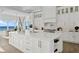 White kitchen with large island and water views at 96 Martinique Ave, Tampa, FL 33606
