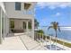 Spacious patio with fire pit, outdoor seating, and water views at 96 Martinique Ave, Tampa, FL 33606