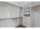 Bright walk-in closet with built-in shelves and drawers at 96 Martinique Ave, Tampa, FL 33606