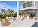 Covered outdoor kitchen area with seating and fire pit at 96 Martinique Ave, Tampa, FL 33606