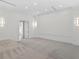 Bright media room with plush carpeting and a large projection screen at 96 Martinique Ave, Tampa, FL 33606