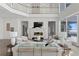 Elegant living room with fireplace and water views at 96 Martinique Ave, Tampa, FL 33606