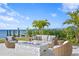 Relaxing patio with fire pit and waterfront view at 96 Martinique Ave, Tampa, FL 33606