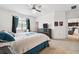 Main bedroom with plush carpeting, ceiling fan, and ensuite bathroom at 12351 Nouveau Ave, Spring Hill, FL 34610