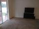Bright living room with sliding glass doors leading to backyard at 10319 Avelar Ridge Dr, Riverview, FL 33578