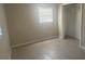 The bedroom has tiled flooring, a window with blinds, and a closet at 1006 39Th W Ave, Bradenton, FL 34205