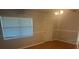 Bedroom features wood laminate flooring, ceiling fan, and a window at 1006 39Th W Ave, Bradenton, FL 34205