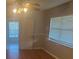 The bedroom features wood laminate flooring, ceiling fan, and a window at 1006 39Th W Ave, Bradenton, FL 34205