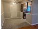 A dining area features a ceiling fan, carpeted flooring, and access to kitchen appliances at 1006 39Th W Ave, Bradenton, FL 34205