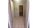 Hallway with tiled floors leads to a bathroom at 1006 39Th W Ave, Bradenton, FL 34205