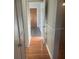 Hallway leading to bedrooms featuring new flooring at 1006 39Th W Ave, Bradenton, FL 34205