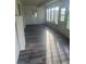 Enclosed sunroom features updated floors and plenty of natural light at 1006 39Th W Ave, Bradenton, FL 34205