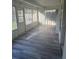 Enclosed sunroom features updated floors and plenty of natural light at 1006 39Th W Ave, Bradenton, FL 34205